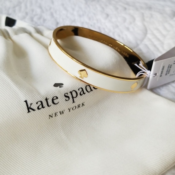 kate spade Jewelry - Kate spade "Ace of Spades" cream and gold bangle